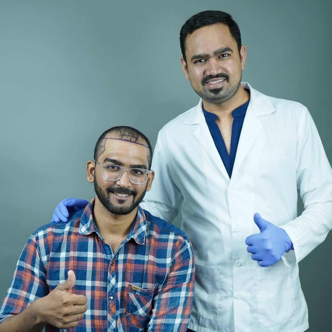 Hairline reconstruction procedure preparation showing a smiling doctor standing next to a male patient who has surgical marking guidelines drawn on his scalp.