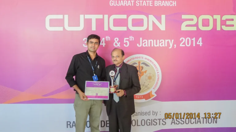 Award-winning hair transplant surgeon Dr. Kiran Chotaliya at a recognition ceremony