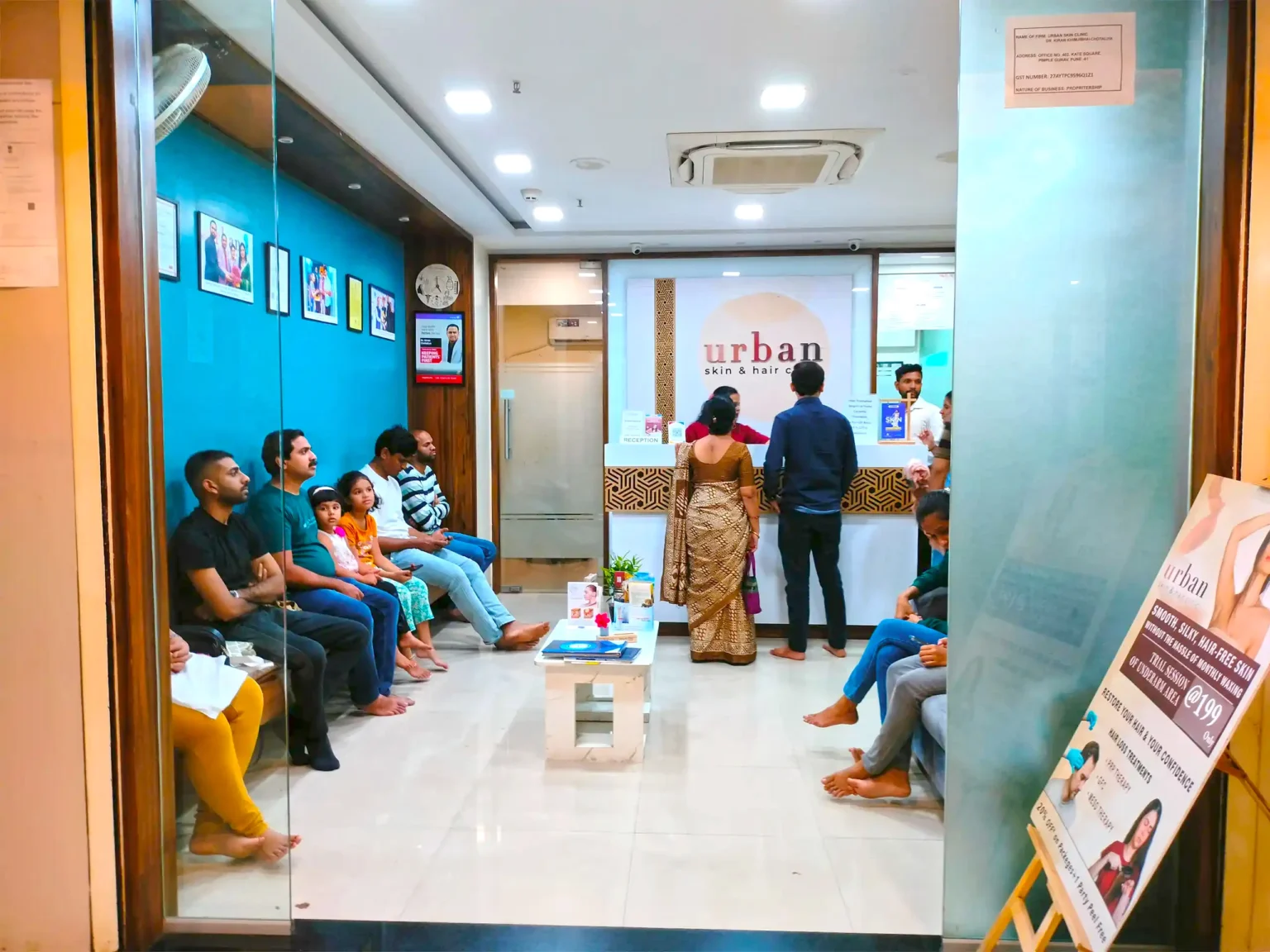 Hair Clinic reception area with patients waiting for dermatology and hair treatment consultations in Pune
